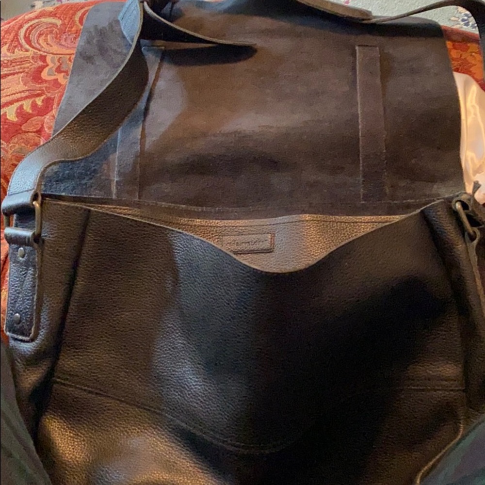 Black pebbled leather messenger bag. Gently used.